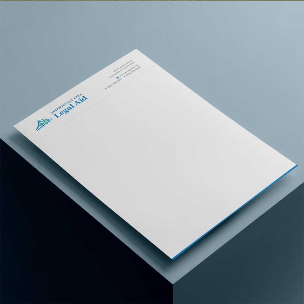 A letterhead design for Jacksonville Area Legal Aid featuring the logo and contact information on white paper against a blue-gray background.